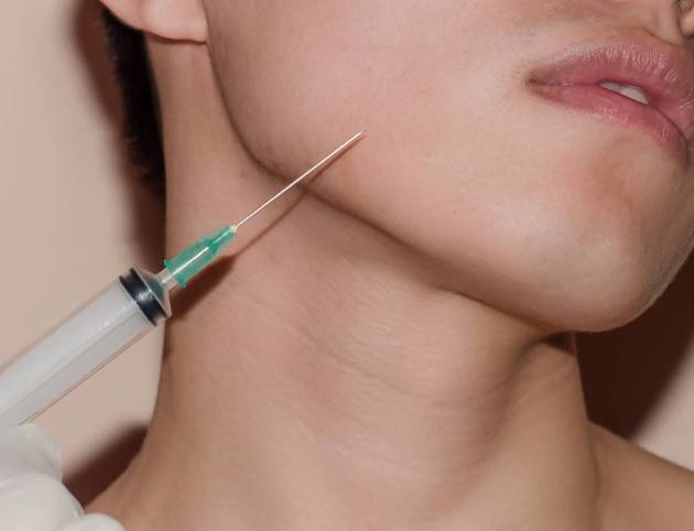 man getting Botox in his jawline